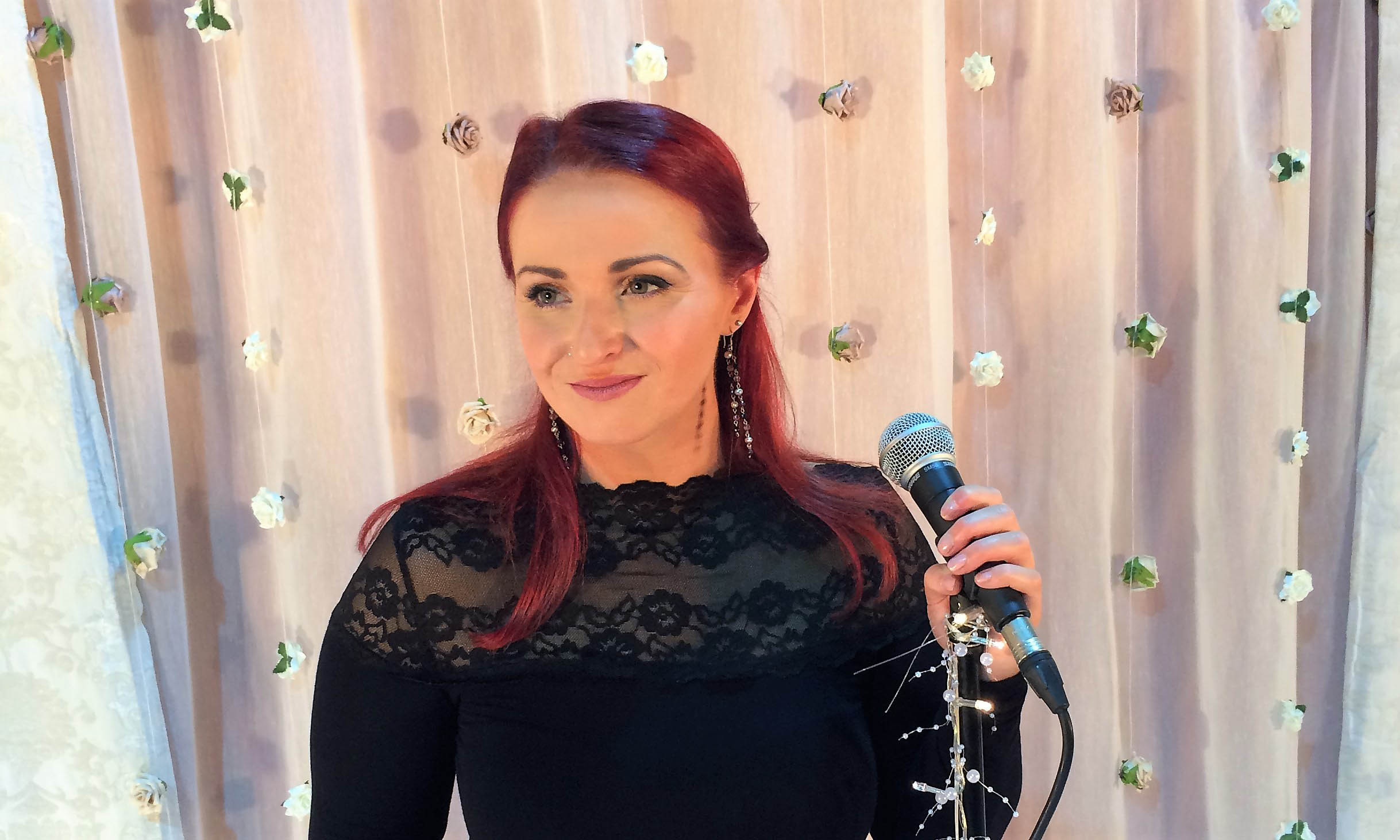 Jenny O'Donovan - Wedding & Events Singer - smiling at a live performance